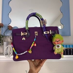 Structured Purple Satchel with Playful Charm Accents
